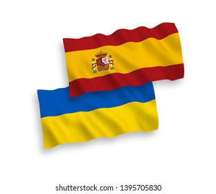 National vector fabric wave flags of Spain and Ukraine isolated on white background. 1 to 2 proportion.