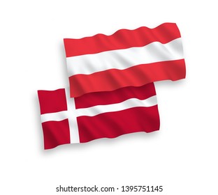 National vector fabric wave flags of Austria and Denmark isolated on white background. 1 to 2 proportion.
