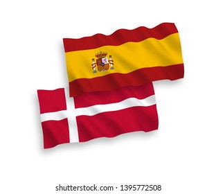 National vector fabric wave flags of Denmark and Spain isolated on white background. 1 to 2 proportion.