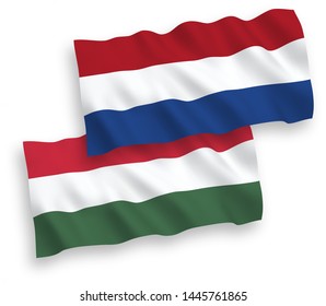 National vector fabric wave flags of Netherlands and Hungary isolated on white background. 1 to 2 proportion.