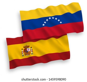 National vector fabric wave flags of Venezuela and Spain isolated on white background. 1 to 2 proportion.