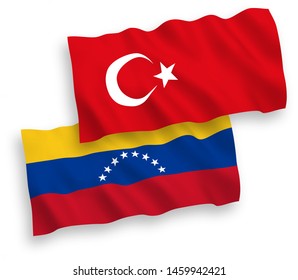 National vector fabric wave flags of Turkey and Venezuela isolated on white background. 1 to 2 proportion.