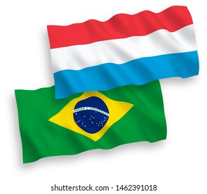 National vector fabric wave flags of Brazil and Luxembourg isolated on white background. 1 to 2 proportion.