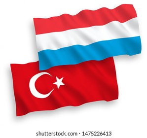 National vector fabric wave flags of Turkey and Luxembourg isolated on white background. 1 to 2 proportion.