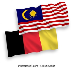 National vector fabric wave flags of Malaysia and Belgium isolated on white background. 1 to 2 proportion.