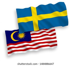 National vector fabric wave flags of Sweden and Malaysia isolated on white background. 1 to 2 proportion.