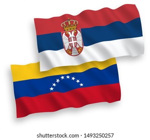 National vector fabric wave flags of Venezuela and Serbia isolated on white background. 1 to 2 proportion.