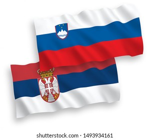 National vector fabric wave flags of Slovenia and Serbia isolated on white background. 1 to 2 proportion.