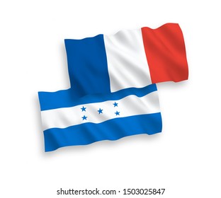 National vector fabric wave flags of France and Honduras isolated on white background. 1 to 2 proportion.