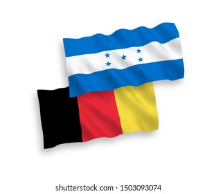 National vector fabric wave flags of Honduras and Belgium isolated on white background. 1 to 2 proportion.