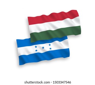 National vector fabric wave flags of Honduras and Hungary isolated on white background. 1 to 2 proportion.