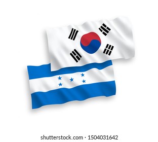 National vector fabric wave flags of South Korea and Honduras isolated on white background. 1 to 2 proportion.