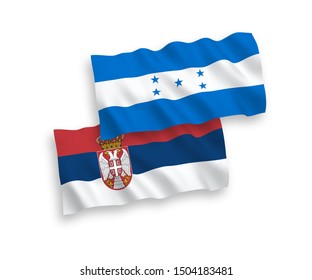 National vector fabric wave flags of Honduras and Serbia isolated on white background. 1 to 2 proportion.