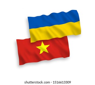 National vector fabric wave flags of Vietnam and Ukraine isolated on white background. 1 to 2 proportion.