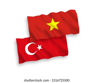 National vector fabric wave flags of Turkey and Vietnam isolated on white background. 1 to 2 proportion.