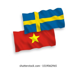 National vector fabric wave flags of Sweden and Vietnam isolated on white background. 1 to 2 proportion.