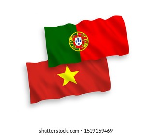National vector fabric wave flags of Portugal and Vietnam isolated on white background. 1 to 2 proportion.