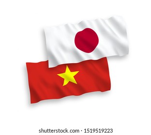 National vector fabric wave flags of Japan and Vietnam isolated on white background. 1 to 2 proportion.