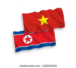 National vector fabric wave flags of North Korea and Vietnam isolated on white background. 1 to 2 proportion.