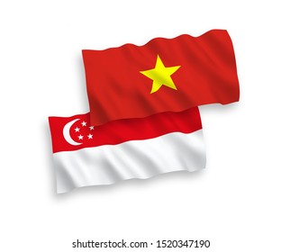National vector fabric wave flags of Vietnam and Singapore isolated on white background. 1 to 2 proportion.