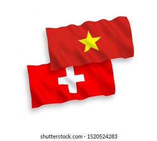 National vector fabric wave flags of Vietnam and Switzerland isolated on white background. 1 to 2 proportion.