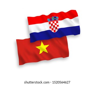 National vector fabric wave flags of Vietnam and Croatia isolated on white background. 1 to 2 proportion.