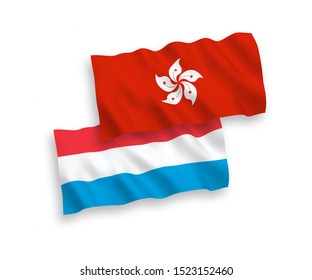 National vector fabric wave flags of Hong Kong and Luxembourg isolated on white background. 1 to 2 proportion.