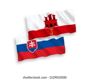 National vector fabric wave flags of Slovakia and Gibraltar isolated on white background. 1 to 2 proportion.
