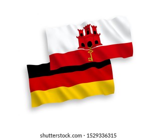 National vector fabric wave flags of Germany and Gibraltar isolated on white background. 1 to 2 proportion.