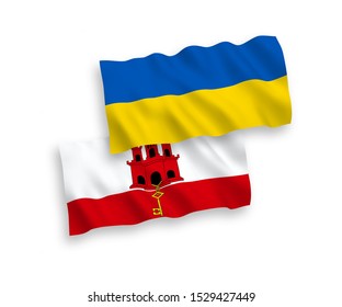 National vector fabric wave flags of Gibraltar and Ukraine isolated on white background. 1 to 2 proportion.