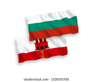 National vector fabric wave flags of Bulgaria and Gibraltar isolated on white background. 1 to 2 proportion.
