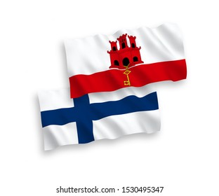 National vector fabric wave flags of Finland and Gibraltar isolated on white background. 1 to 2 proportion.