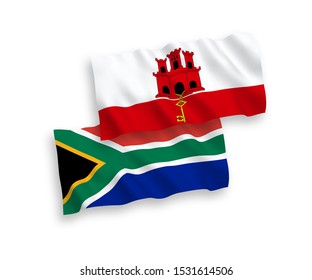 National vector fabric wave flags of Gibraltar and Republic of South Africa isolated on white background. 1 to 2 proportion.