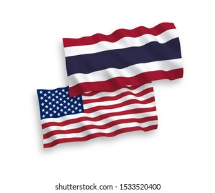 National vector fabric wave flags of Thailand and USA isolated on white background. 1 to 2 proportion.