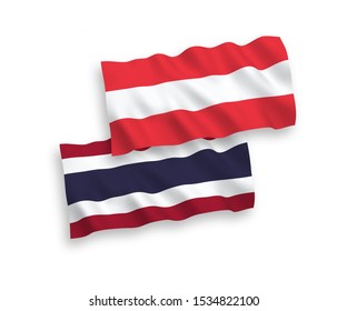 National vector fabric wave flags of Austria and Thailand isolated on white background. 1 to 2 proportion.