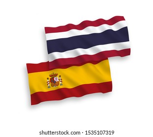 National vector fabric wave flags of Thailand and Spain isolated on white background. 1 to 2 proportion.