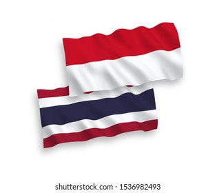 National vector fabric wave flags of Indonesia and Thailand isolated on white background. 1 to 2 proportion.