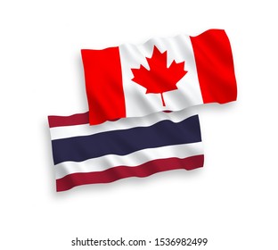 National vector fabric wave flags of Canada and Thailand isolated on white background. 1 to 2 proportion.