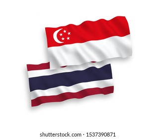 National vector fabric wave flags of Thailand and Singapore isolated on white background. 1 to 2 proportion.