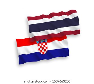 National vector fabric wave flags of Thailand and Croatia isolated on white background. 1 to 2 proportion.