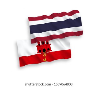 National vector fabric wave flags of Thailand and Gibraltar isolated on white background. 1 to 2 proportion.