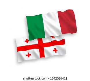 National vector fabric wave flags of Italy and Georgia isolated on white background. 1 to 2 proportion.