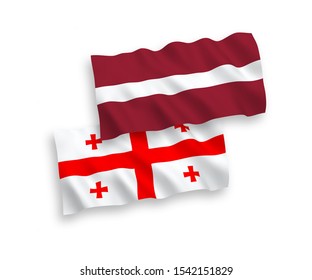National vector fabric wave flags of Latvia and Georgia isolated on white background. 1 to 2 proportion.