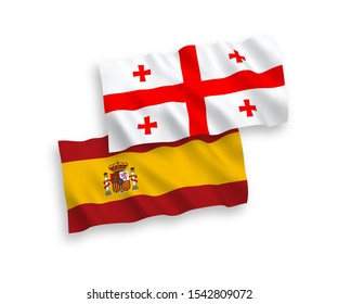 National vector fabric wave flags of Georgia and Spain isolated on white background. 1 to 2 proportion.