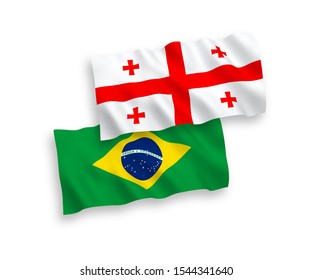 National vector fabric wave flags of Brazil and Georgia isolated on white background. 1 to 2 proportion.