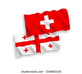 National vector fabric wave flags of Georgia and Switzerland isolated on white background. 1 to 2 proportion.