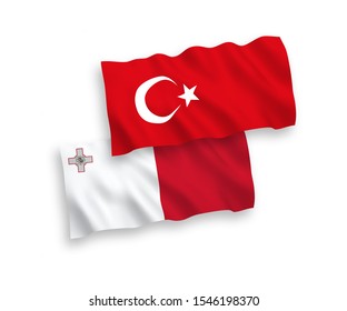 National vector fabric wave flags of Turkey and Malta isolated on white background. 1 to 2 proportion.