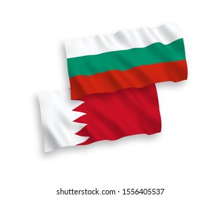 National vector fabric wave flags of Bulgaria and Bahrain isolated on white background. 1 to 2 proportion.