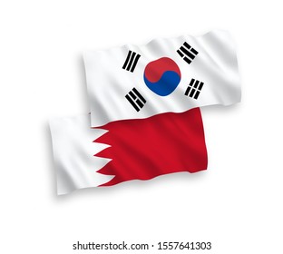 National vector fabric wave flags of South Korea and Bahrain isolated on white background. 1 to 2 proportion.