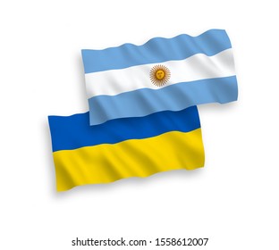 National vector fabric wave flags of Argentina and Ukraine isolated on white background. 1 to 2 proportion.